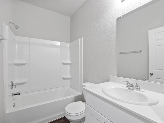 full bathroom featuring hardwood / wood-style flooring, vanity, shower / bathtub combination, and toilet