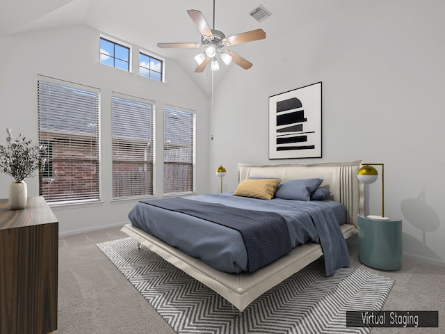 bedroom with ceiling fan, carpet floors, and lofted ceiling