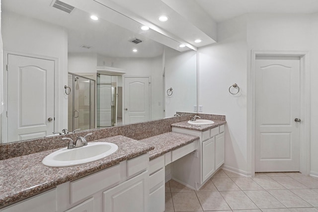 bathroom featuring tile patterned flooring, vanity, and an enclosed shower