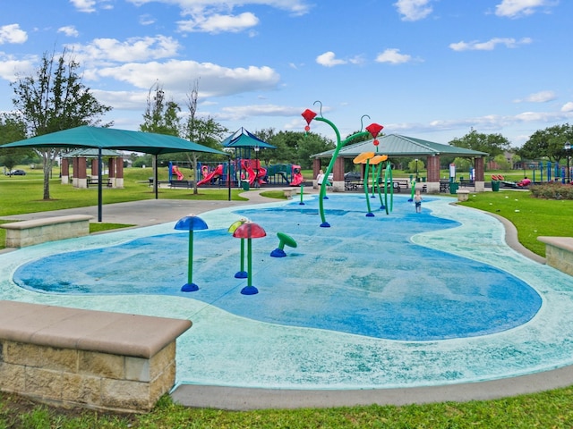 surrounding community featuring a gazebo, a playground, and a lawn