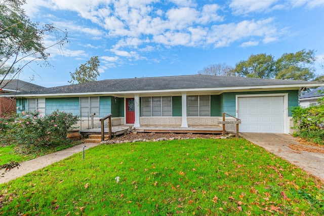 single story home featuring a garage and a front lawn