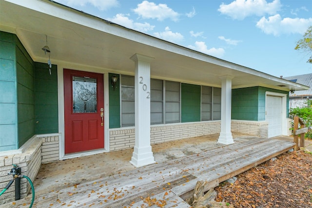 doorway to property featuring covered porch