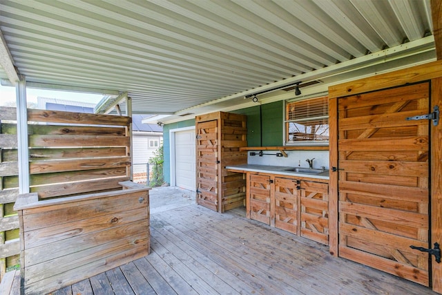 wooden terrace featuring sink and an outdoor kitchen