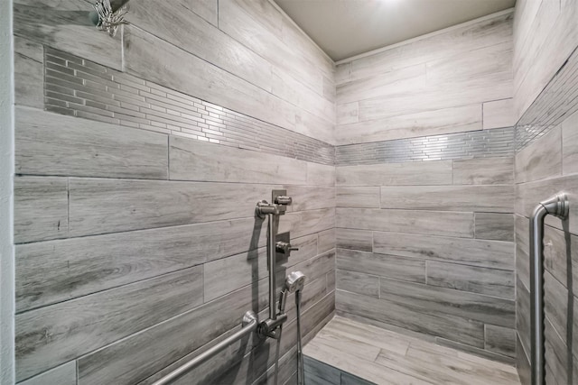 bathroom with a tile shower