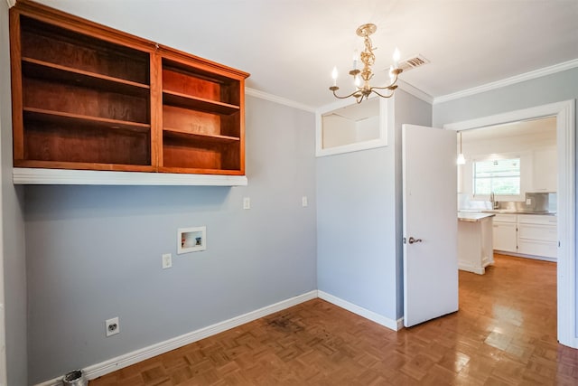 laundry area with hookup for a washing machine, ornamental molding, sink, a notable chandelier, and light parquet flooring