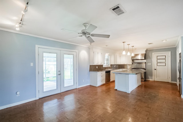 kitchen featuring a center island, french doors, range hood, white cabinetry, and stainless steel appliances