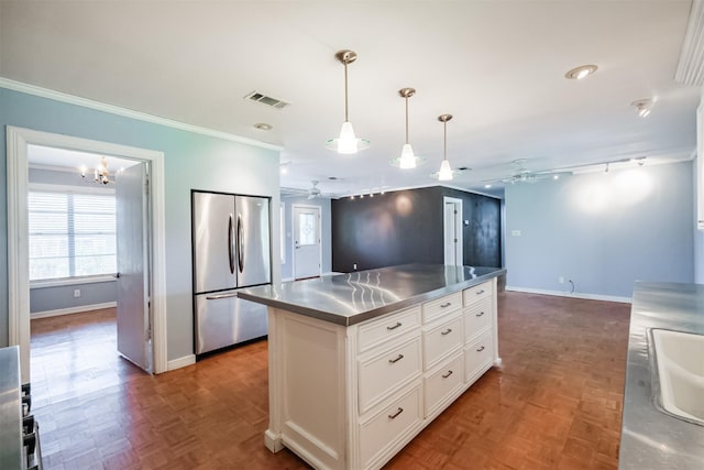 kitchen featuring ceiling fan with notable chandelier, dark parquet floors, stainless steel fridge, stainless steel counters, and white cabinetry