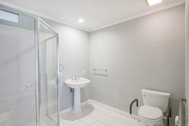 bathroom with tile patterned floors, toilet, a shower with shower door, and ornamental molding