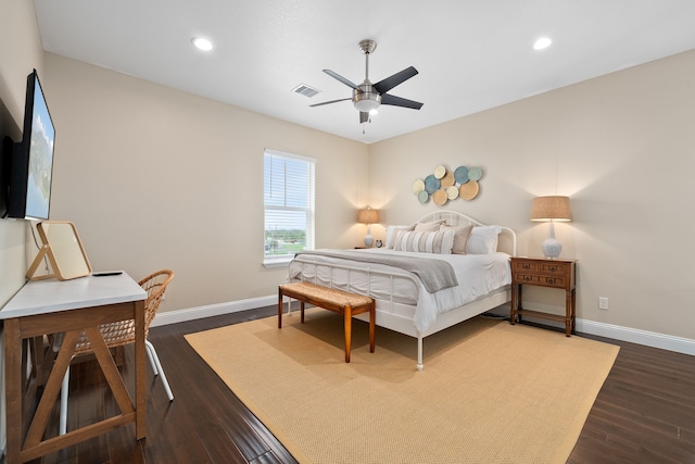 bedroom with ceiling fan and dark wood-type flooring