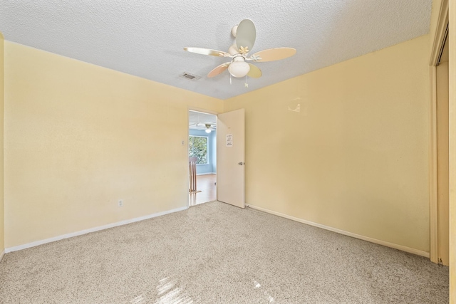 unfurnished room with a textured ceiling