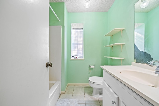 full bathroom featuring tile patterned floors, a textured ceiling, vanity, washtub / shower combination, and toilet