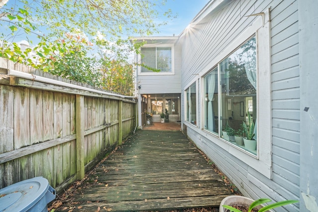 wooden terrace featuring a sunroom