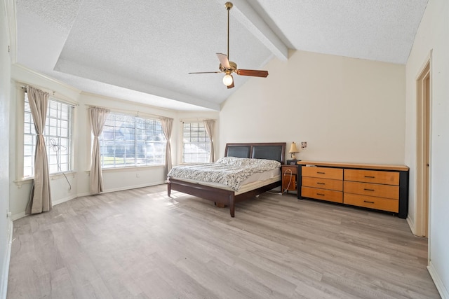 bedroom featuring light wood-type flooring, a textured ceiling, and ceiling fan