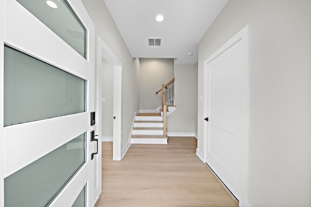 corridor featuring light hardwood / wood-style flooring