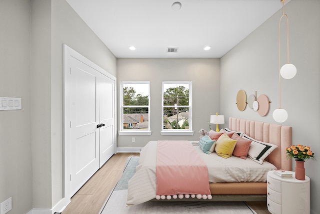 bedroom featuring light wood-type flooring