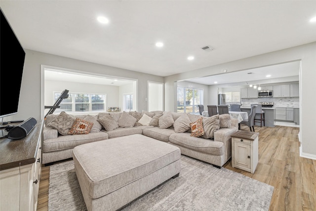 living room with light hardwood / wood-style flooring