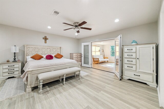 bedroom featuring ceiling fan and light hardwood / wood-style flooring