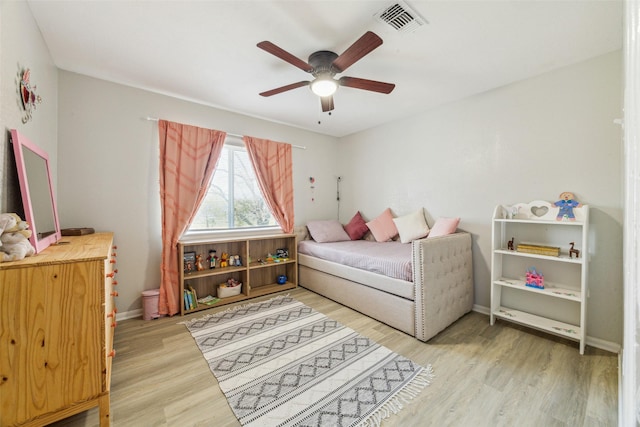 bedroom featuring ceiling fan and light hardwood / wood-style flooring