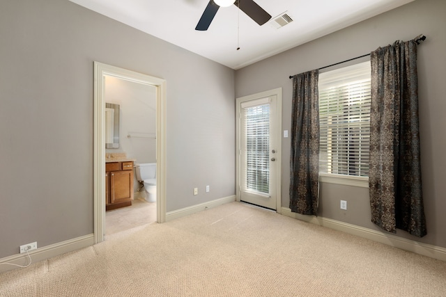 empty room featuring light carpet and ceiling fan