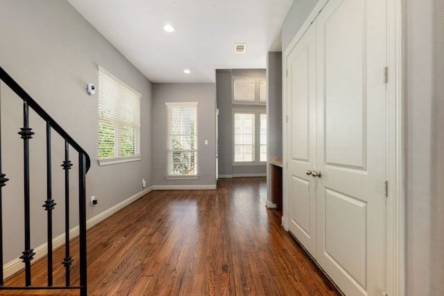 entrance foyer featuring dark wood-type flooring