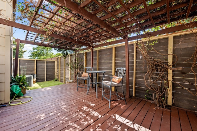 wooden terrace featuring a pergola and central air condition unit