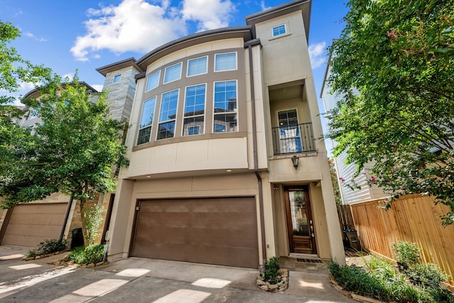 multi unit property featuring a garage