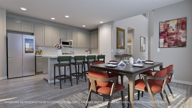 dining room with light hardwood / wood-style flooring