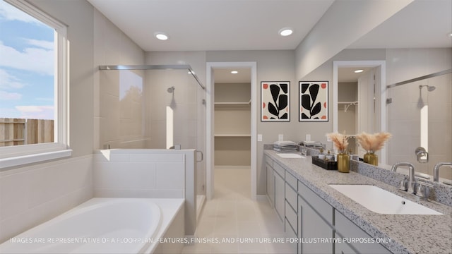 bathroom with tile patterned flooring, independent shower and bath, and vanity