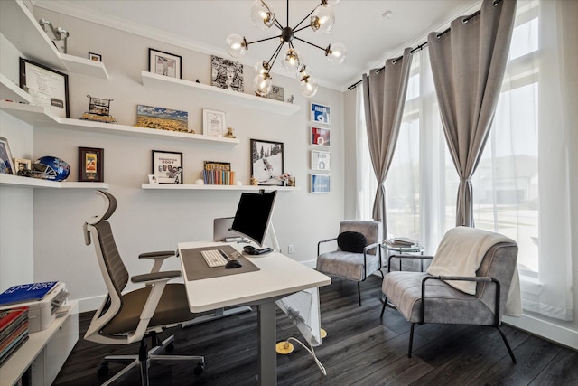 office with dark wood finished floors, an inviting chandelier, and ornamental molding