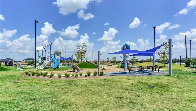 view of jungle gym featuring a lawn