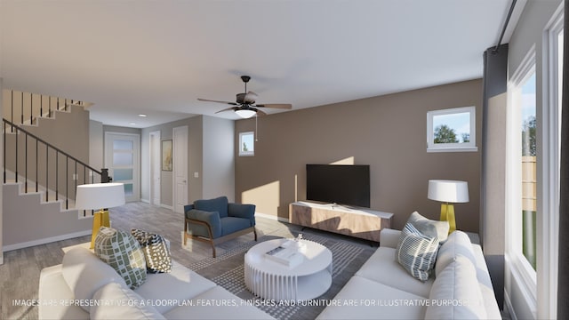 living room featuring ceiling fan and wood-type flooring