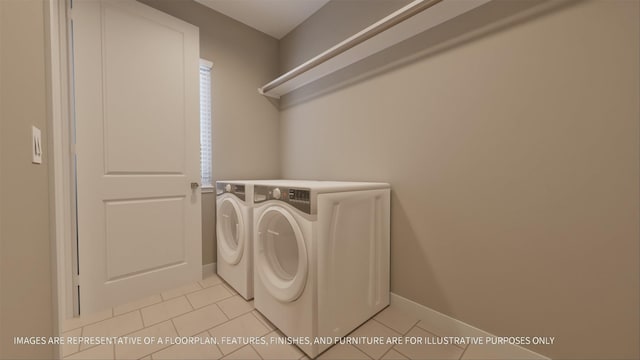 laundry room with washer and dryer and light tile patterned floors