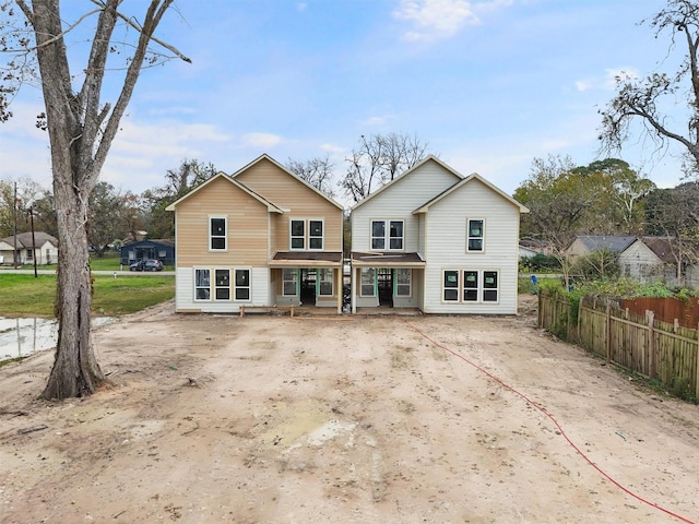 back of property featuring covered porch