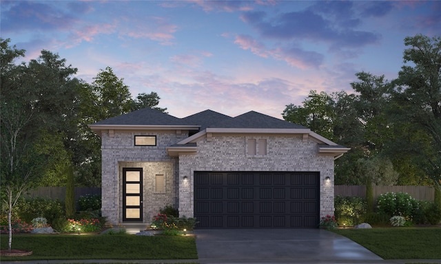 view of front of property with a garage