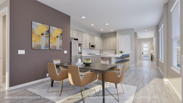 dining area featuring light wood-type flooring