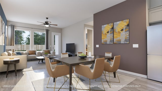 dining room featuring ceiling fan and light hardwood / wood-style floors