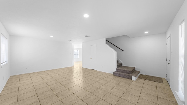 interior space featuring a wealth of natural light and light tile patterned floors