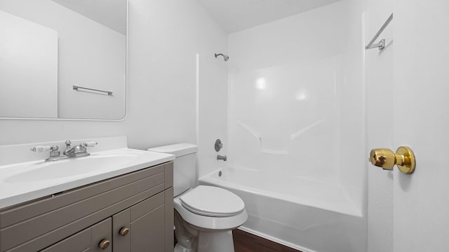 full bathroom featuring bathtub / shower combination, wood-type flooring, vanity, and toilet