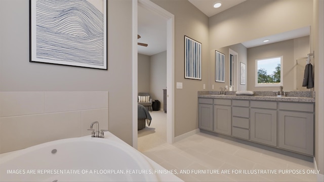 bathroom with a tub to relax in, tile patterned flooring, and vanity