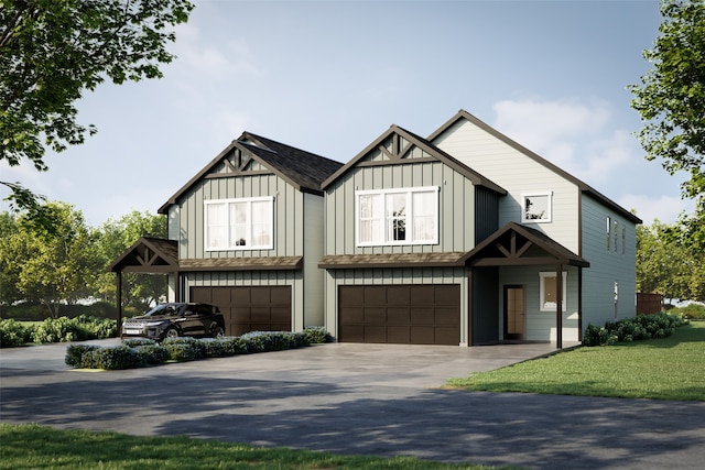 view of front facade with a garage and a front lawn