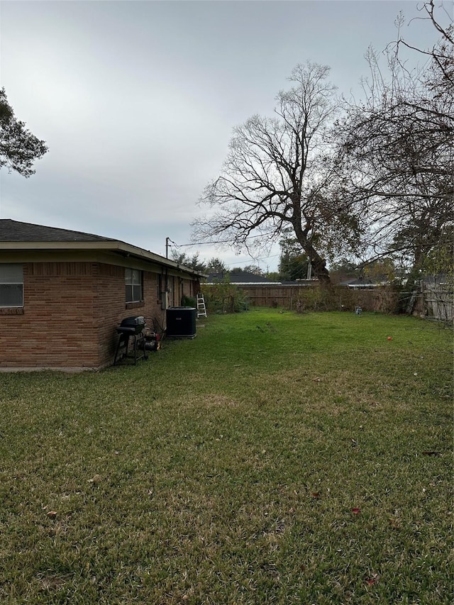 view of yard featuring central AC