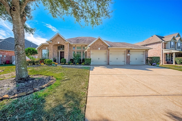 single story home featuring a garage and a front lawn