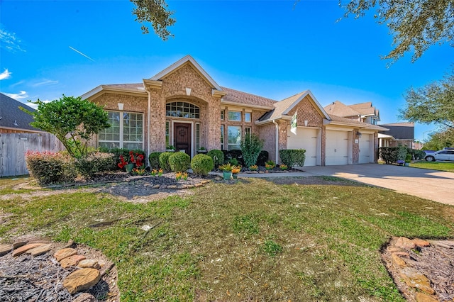 view of front of property with a front lawn and a garage