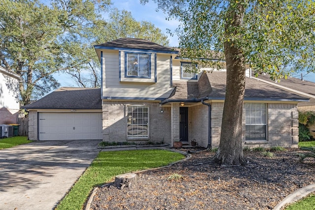 front facade with a garage and central AC unit