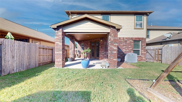 back of house featuring a yard, a patio, and cooling unit