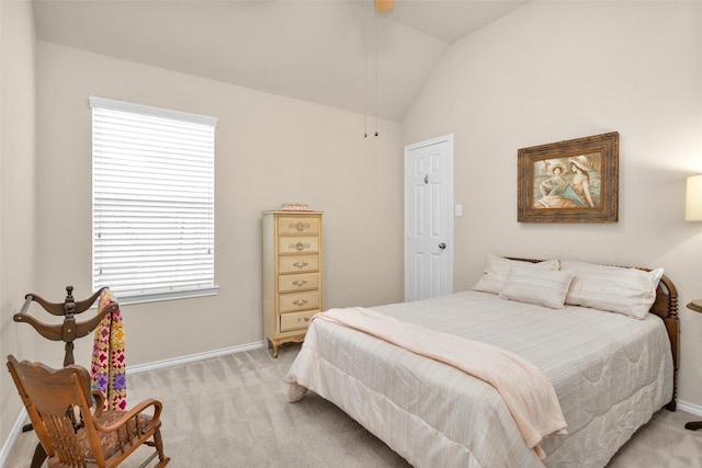 carpeted bedroom with multiple windows and vaulted ceiling