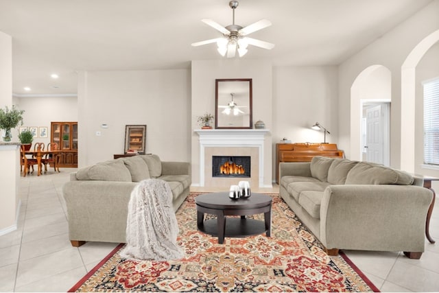 living room with ceiling fan and light tile patterned floors