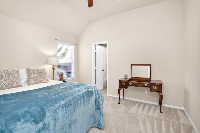 carpeted bedroom with ceiling fan and lofted ceiling