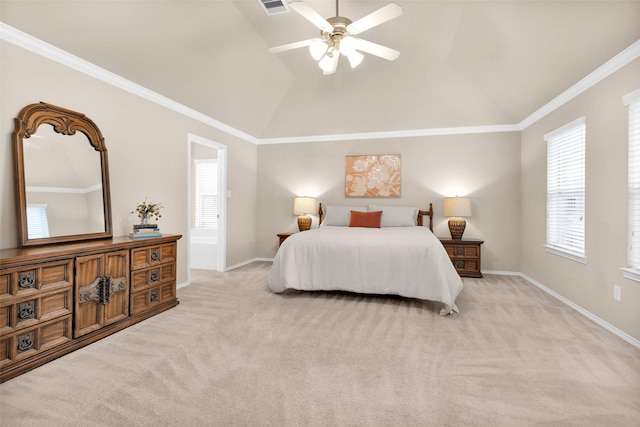 bedroom featuring ceiling fan, light colored carpet, ornamental molding, and vaulted ceiling