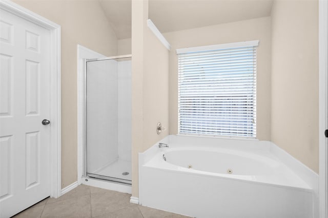 bathroom featuring tile patterned flooring and independent shower and bath